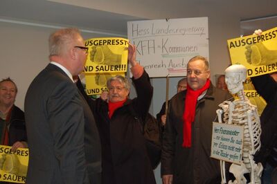 Robert Heimrich und Dieter Birkelbach im Gespräch mit dem Finanzminister (v.r.)